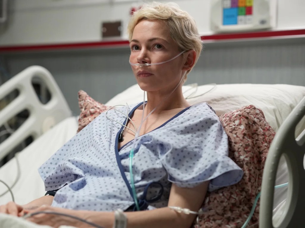 Molly (Michelle Williams) istuu sairaalasängyllä happiviikset nenässään.